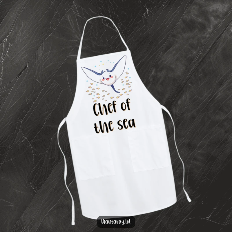 Funny Apron featuring a triumphant manta ray with wings outstretched, soaring through a school of tiny fish, a champion's kitchen accessory.